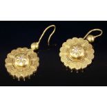 A pair of Victorian gold and diamond drop earrings,with a raised central boss, star set with an