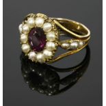 A Georgian gold foiled amethyst and split pearl ring,with an oval mixed cut foil back amethyst,