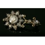 A Georgian diamond set Halley's Comet brooch, c.1830,with a rose cut diamond in a cut down collet at