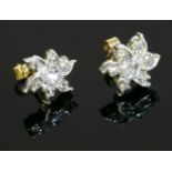 A pair of diamond cluster earrings, 19th century,on later post fittings. Each flower head cluster
