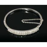A late Victorian two row diamond set bangle,with two rows of graduated old Swiss cut and eight cut