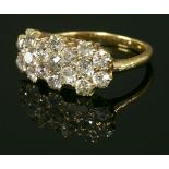 A late Victorian diamond set triple cluster ring, c.1900,with graduated old European cut diamonds,
