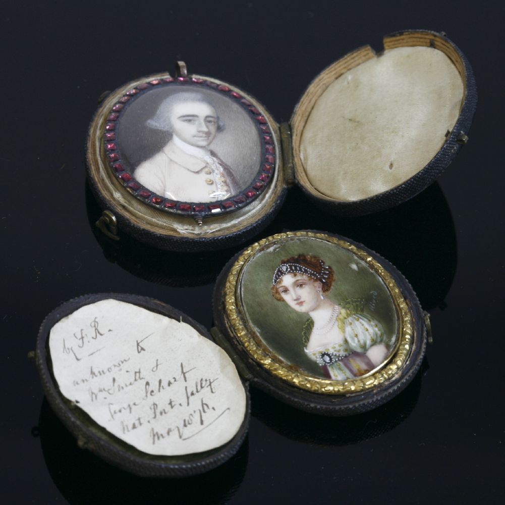 A gold mounted portrait miniature pendant with a garnet border, late 18th century, the painted