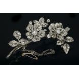 A Victorian diamond set en tremblant spray brooch, c.1860,with two en tremblant flower heads and a