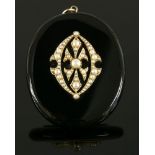 A late Victorian split pearl and onyx locket back pendant,with an oval onyx plaque, with applied