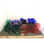 Coloured glassware, five green glass rinsers, five blue glass runners, seven cranberry beakers and
