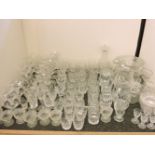 A collection of cut glassware, beakers, glasses, custard dishes, bowls and decanters