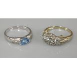 A 9ct gold aquamarine and diamond regal cluster ring, and a 9ct white gold single stone blue topaz