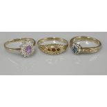 A 9ct gold amethyst and diamond oval cluster ring, a 9ct gold heart shaped blue topaz and diamond