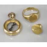 An 18ct gold compass fob, an 18ct gold oval signet ring, and a dress stud marked 18ct