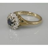 A 9ct gold sapphire and diamond cluster ring