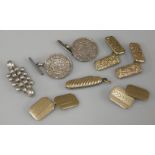 A pair of 9ct gold cufflinks, a miniature penknife with ridged gold outer casing marked 9ct, coin