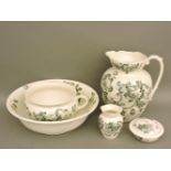 A Victorian painted wash and basin set, comprising soap dish and cover, vase, potty, and bowl and