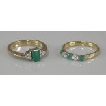 A 9ct gold emerald and diamond seven stone lozenge shaped ring, and an 18ct gold emerald and diamond