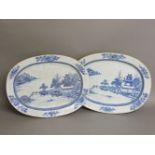 Two similar Chinese blue and white export meat dishes, each centred with a view of islands, a