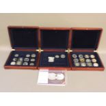 Approximately thirteen silver proof crown size coins, six £5 coins, and other crown size coins