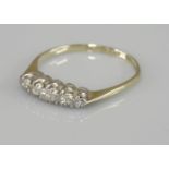 A five stone graduated diamond ring, marked 18ct plat