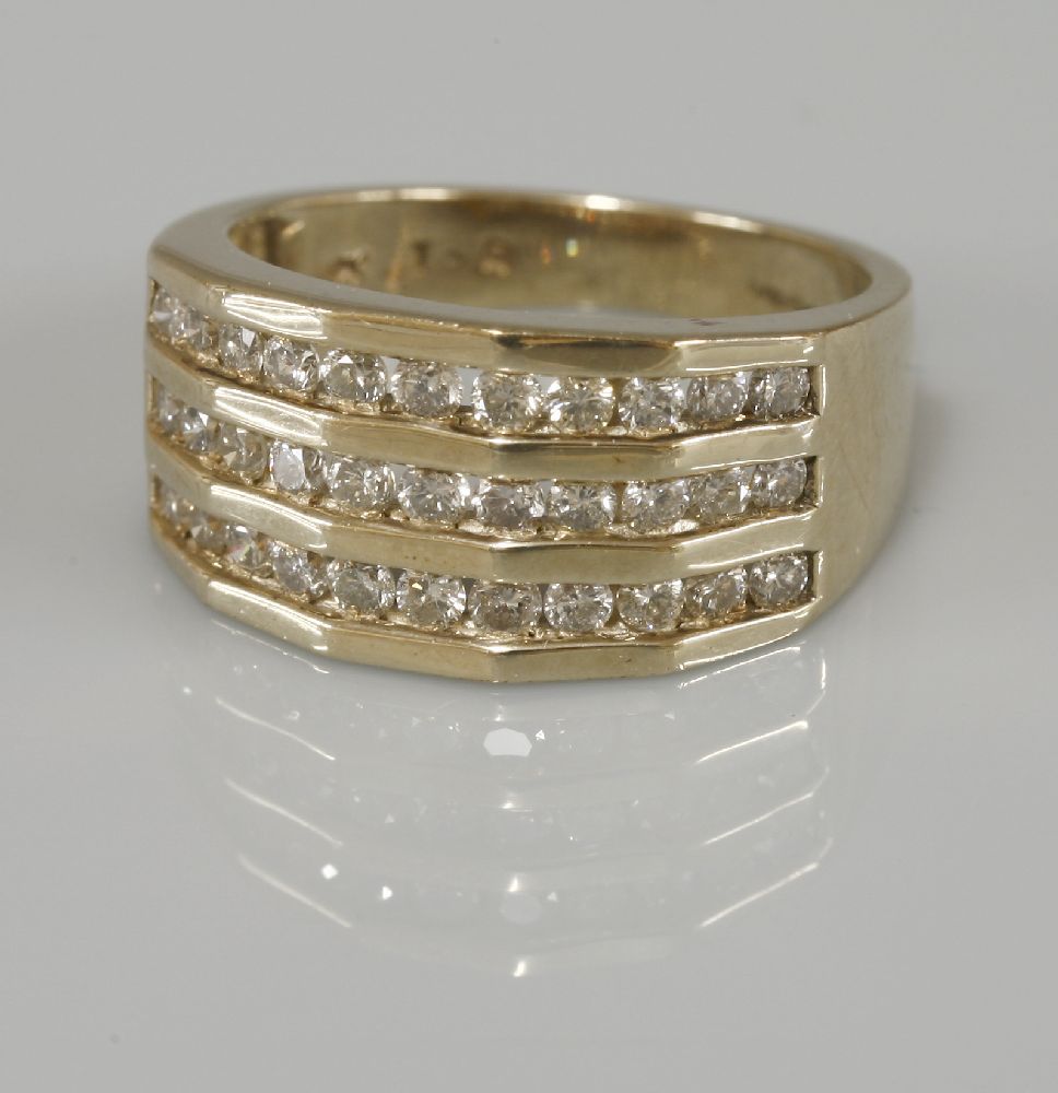 A 9ct gold three row channel set diamond ring, with a total stated weight of 1.00ct