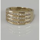 A 9ct gold three row channel set diamond ring, with a total stated weight of 1.00ct