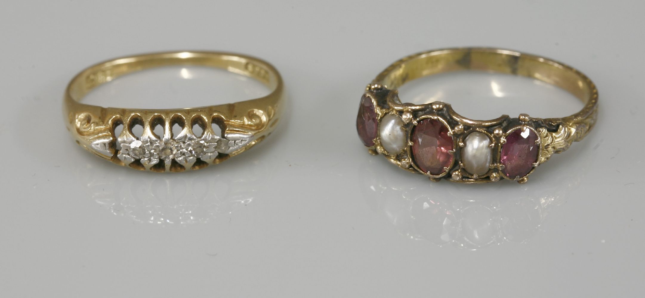 A five stone diamond boat shaped ring, marked 18ct, and a Victorian five stone garnet and split