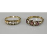 A five stone diamond boat shaped ring, marked 18ct, and a Victorian five stone garnet and split