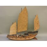 A model of a Chinese junk, circa 1930s, with three sails and a crew, 70cm long