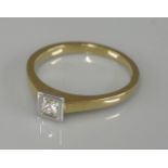 An 18ct gold single stone princess cut diamond, with a rub over white collet