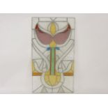 A Continental stained and leaded rectangular glass window panel, circa 1910, with a stylised