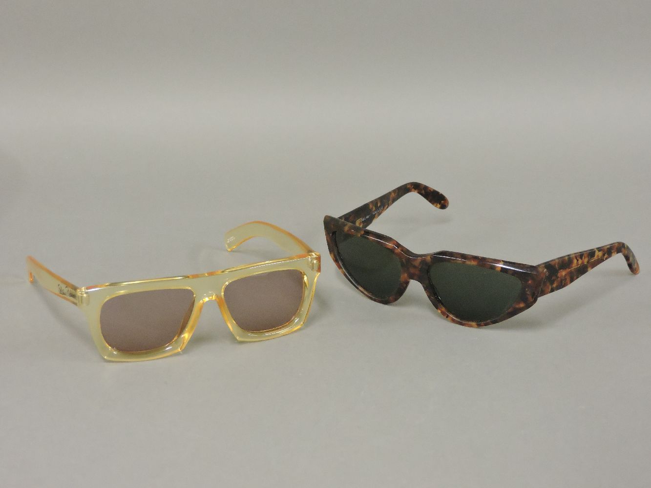 A pair of Ray-Ban onyx WO804 vintage sunglasses,with original case,together with a pair of Paloma