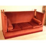 A large burgundy upholstered Knoll Sofa,