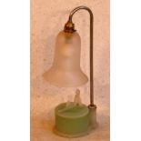 An Art Deco period glass Lamp, the bell shaped Shade above a circular green glass box, the lid