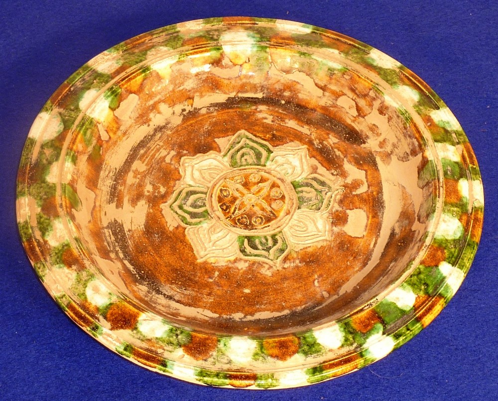 Tang Dynasty (618 - 906AD), a Sancai Dish (three colours) central incised with a flower head, good