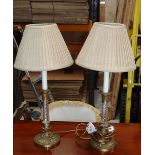 A pair of French restoration style brass