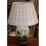 A modern Table Lamp decorated with lilie