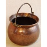 A good 19th Century copper Cauldron having iron swing handle, 34cm diameter x 27cm high