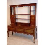A good late 18th Century Shropshire oak Dresser, the flaring cornice above a wavy frieze and