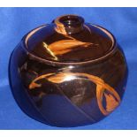 A modern black gloss glazed Studio Pottery Pot and Cover decorated in abstract style with
