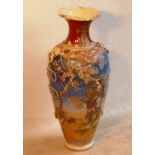 A large early 20th Century baluster shaped Japanese Satsuma pottery Vase, the crimped edge top