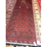 A red ground hand made Afghan Runner, 2.