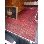 A red ground hand made Afghan Carpet, 2.