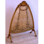 A large and unusual 19th Century lancet shaped Screen, the gilt frame decorated with large central