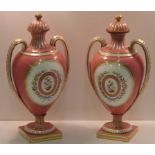 A pair of 19th Century Coalport Porcelain two handled urn shaped Vases (restored),