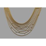 CARTIERORIGINAL COLLIER DRAPERIEcomposé de dix rangs de petites boules d'or jaune 18K ponctuées de