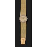 PIAGET VERS 1960 Montre bracelet de dame extra-plate en or jaune. Boîtier rond avec lunette sertie