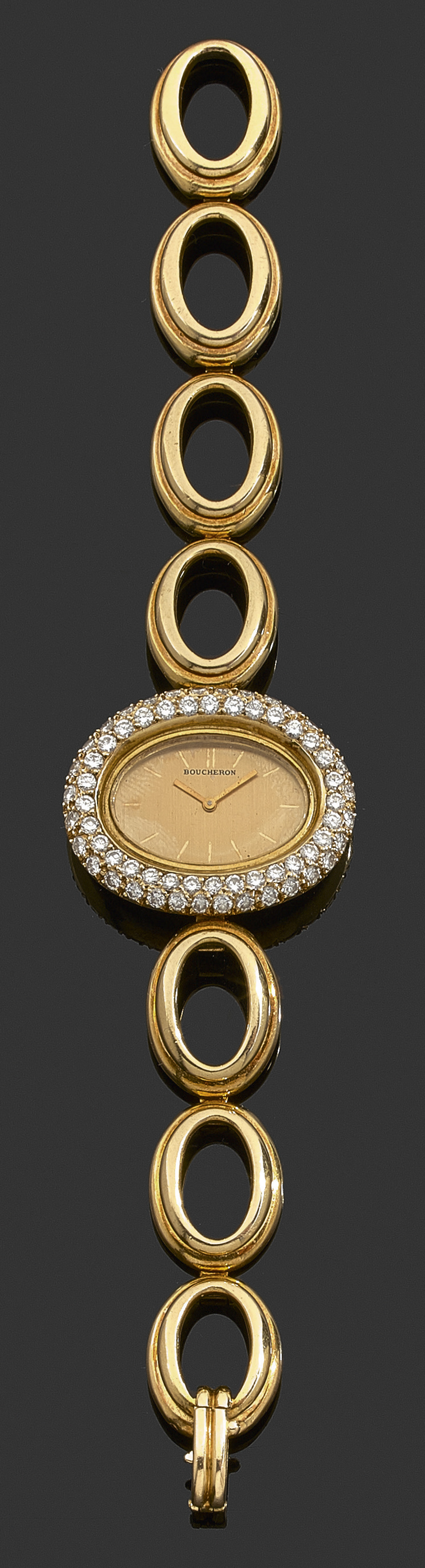 BOUCHERONANNÉES 70COMMANDE PARTICULIèREMontre bracelet de dame en or jaune et diamants. Boîtier