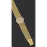 PIAGETVERS 1960Montre bracelet de dame extra-plate en or jaune. Boîtier rond avec lunette sertie