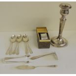 A silver candlestick, hallmarked for Birmingham 1932, weighted base, a boxed silver napkin ring, six