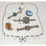 An assortment of costume jewellery, including a Scottish silver brooch by "JOHN MCGILVRAY, IONA" bar