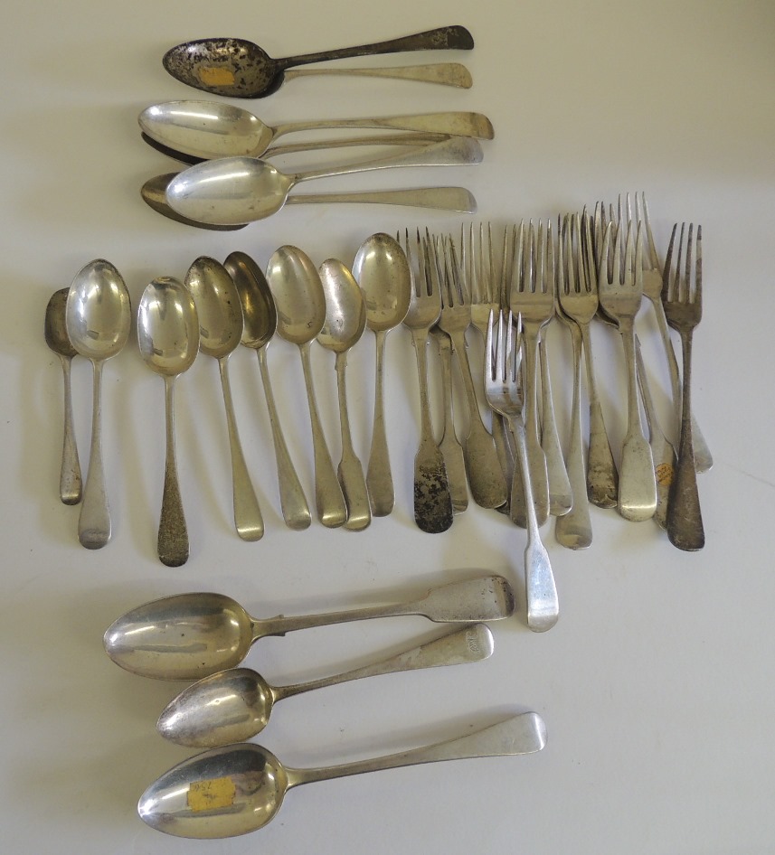 A collection of assorted silver forks, desert spoons and tablespoons, mostly singles and assorted