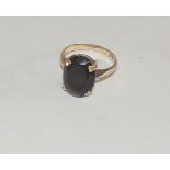 A ladies 9ct gold dress ring, set with a faceted smoky quartz. Ring size J +.